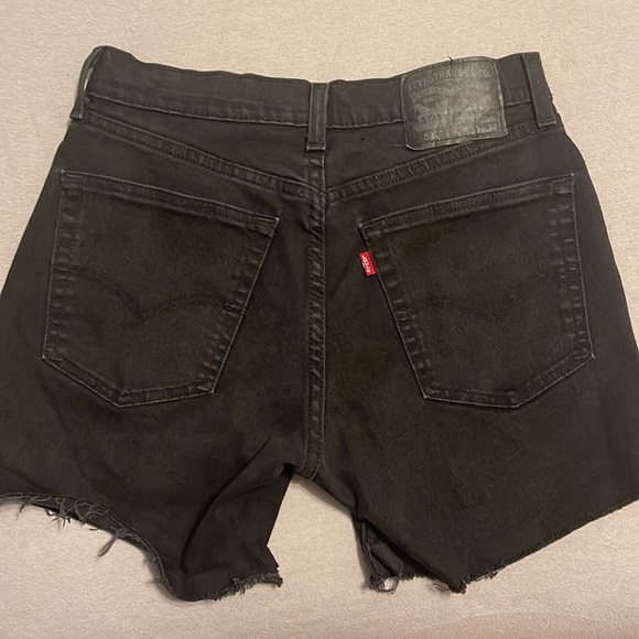 Cute black Levi’s 501 shorts, I would say it’s pretty high rise - Picture 2 of 7